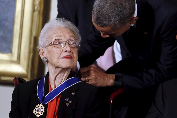U.S. President Barack Obama presents the Presidential Medal of Freedom to NASA mathematician Katherine G. Johnson during an event in the East Room of the White House in Washington November 24, 2015. Johnson is a pioneer in American space history. REUTERS/Carlos Barria - RTX1VP9Z