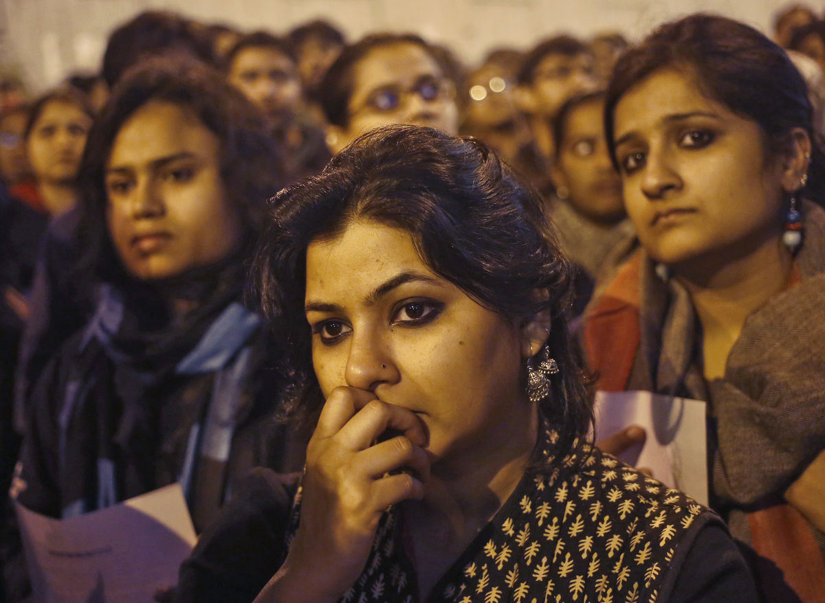 Demonstrators attend a candlelight vigil to mark the first anniversary of Delhi gang rape, in New Delhi