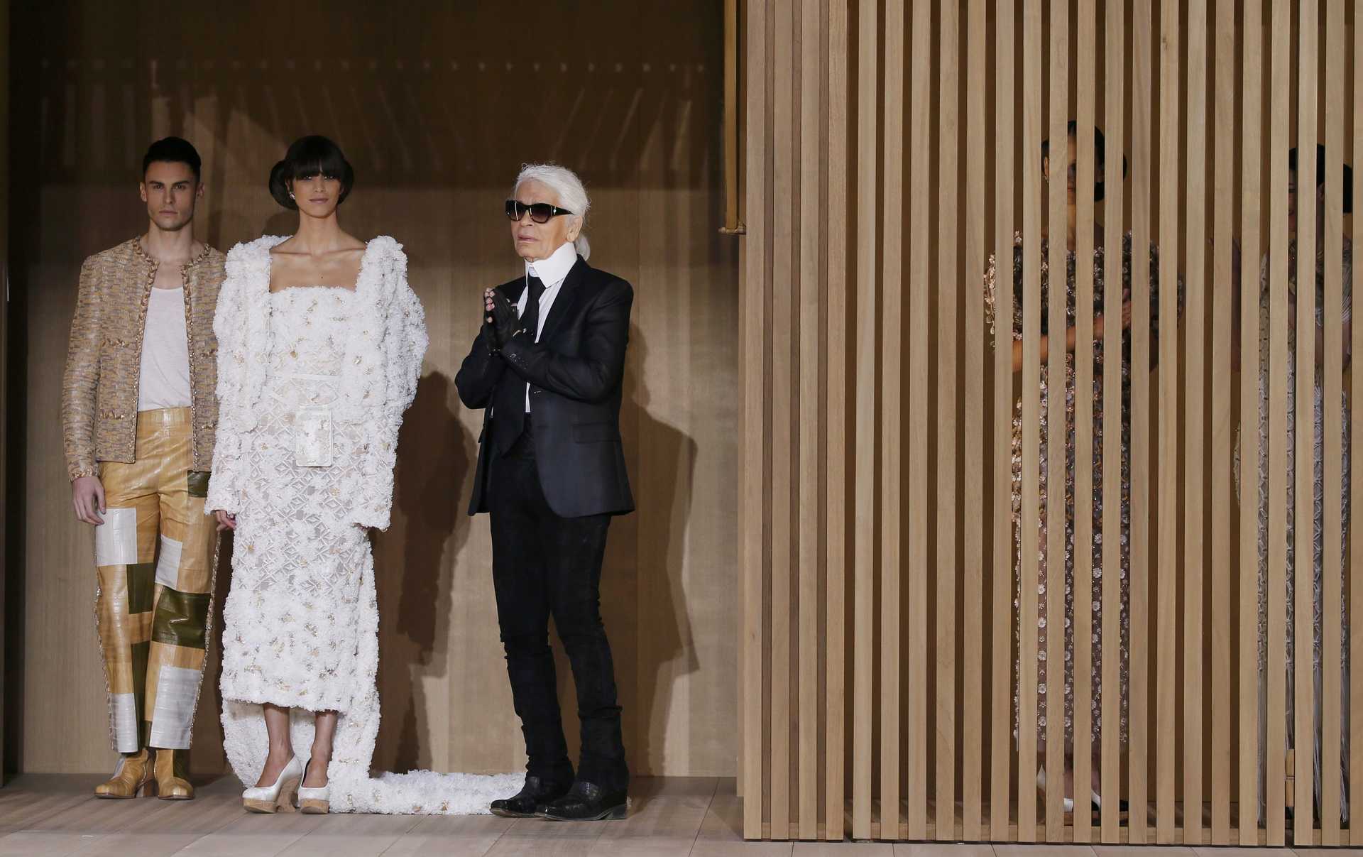 German designer Karl Lagerfeld appears at the end his Haute Couture Spring/Summer 2016 collection for fashion house Chanel at the Grand Palais in Paris