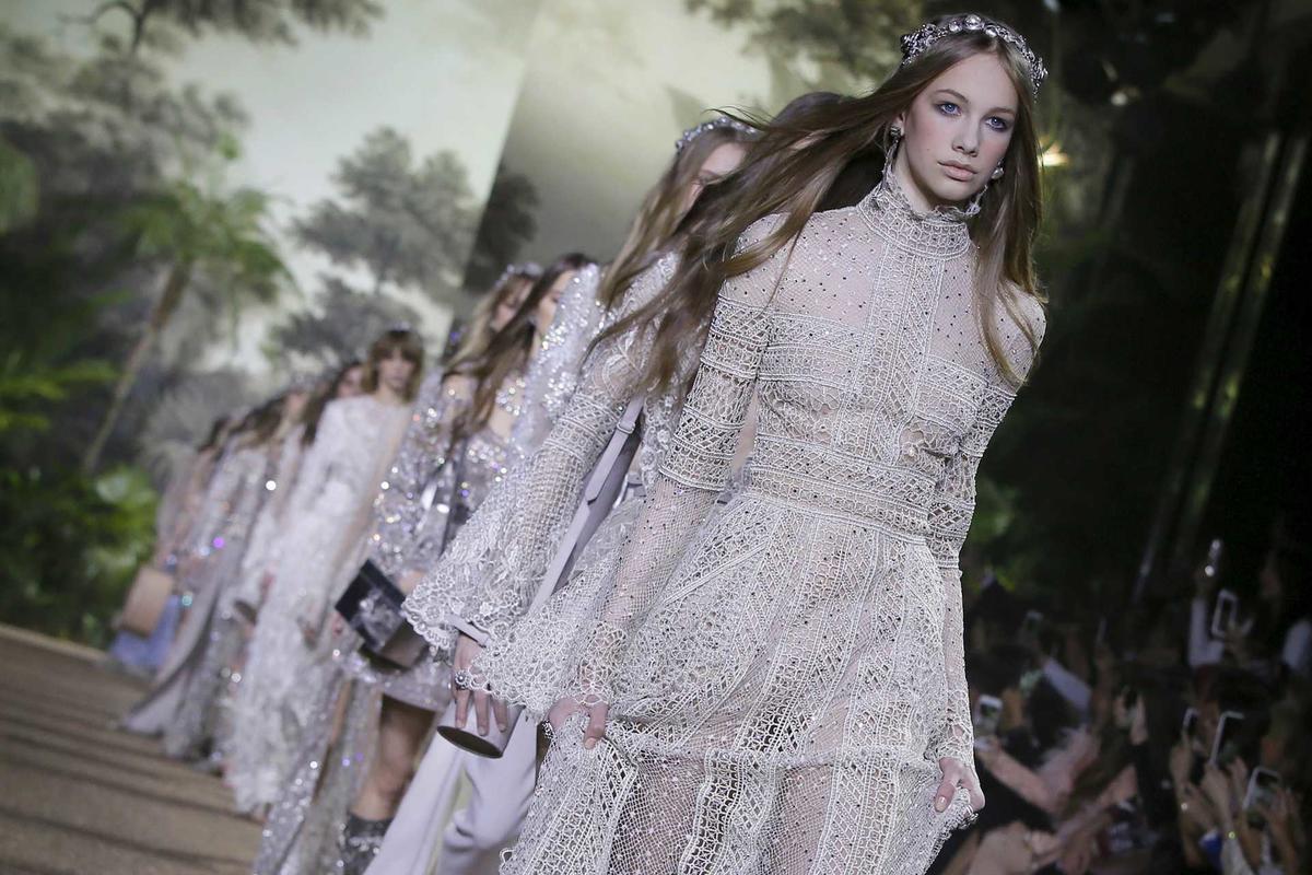 Models present creations by Lebanese designer Elie Saab as part of his Haute Couture Spring/Summer 2016 collection in Paris