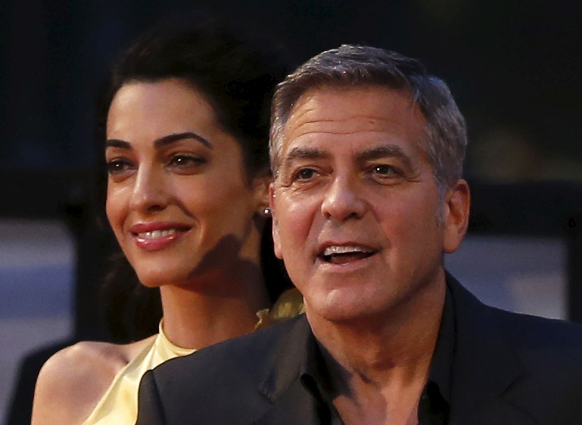 O ator George Clooney com a sua mulher, Amal, na apresentação do filme "Tomorrowland" ("A Terra do Amanhã"), em Tóquio, em maio de 2015 (REUTERS/Toru Hanai)