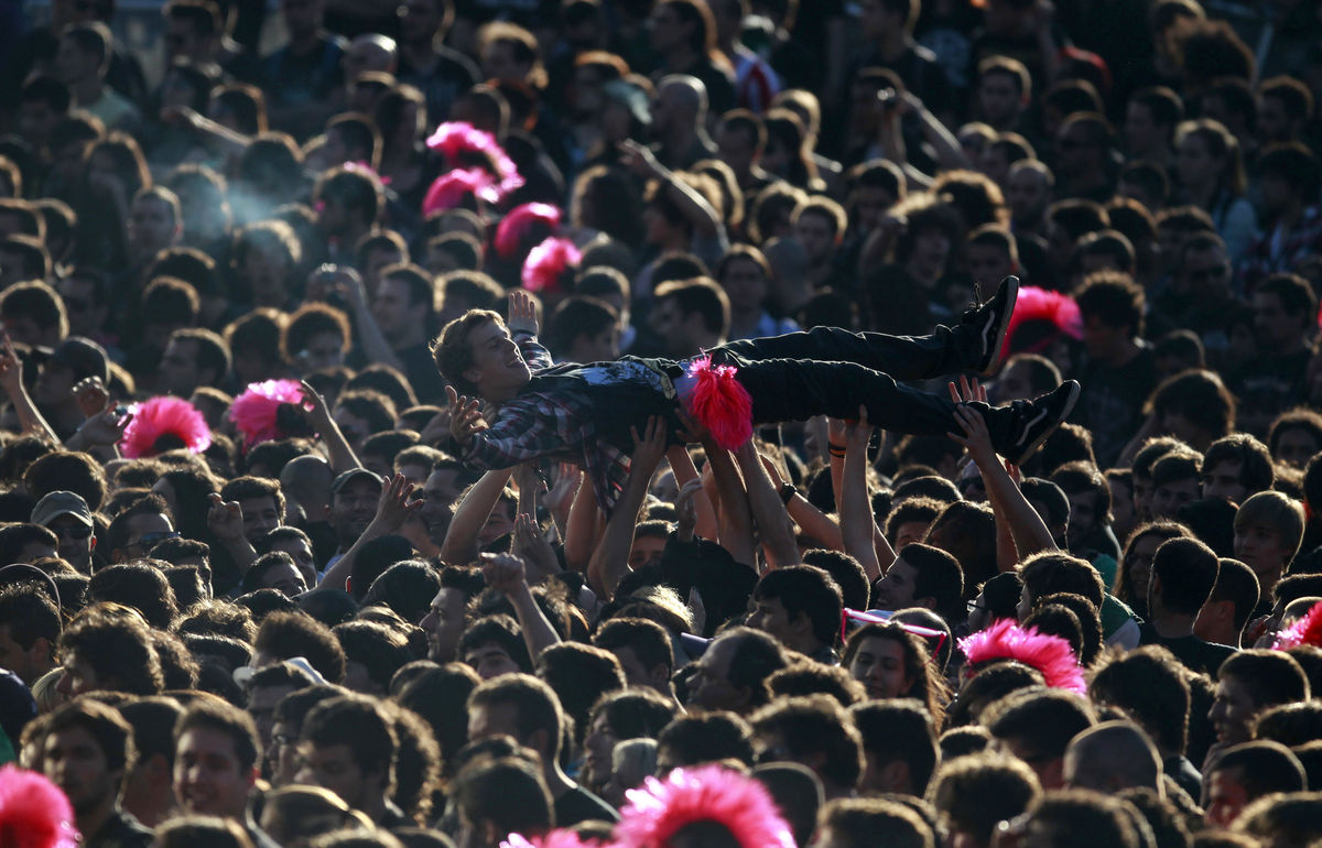A man is lifted up by the crowd during the performance of Brazilian band ‘Sepultura’ at the Rock in Rio Music Festival in Lisbon