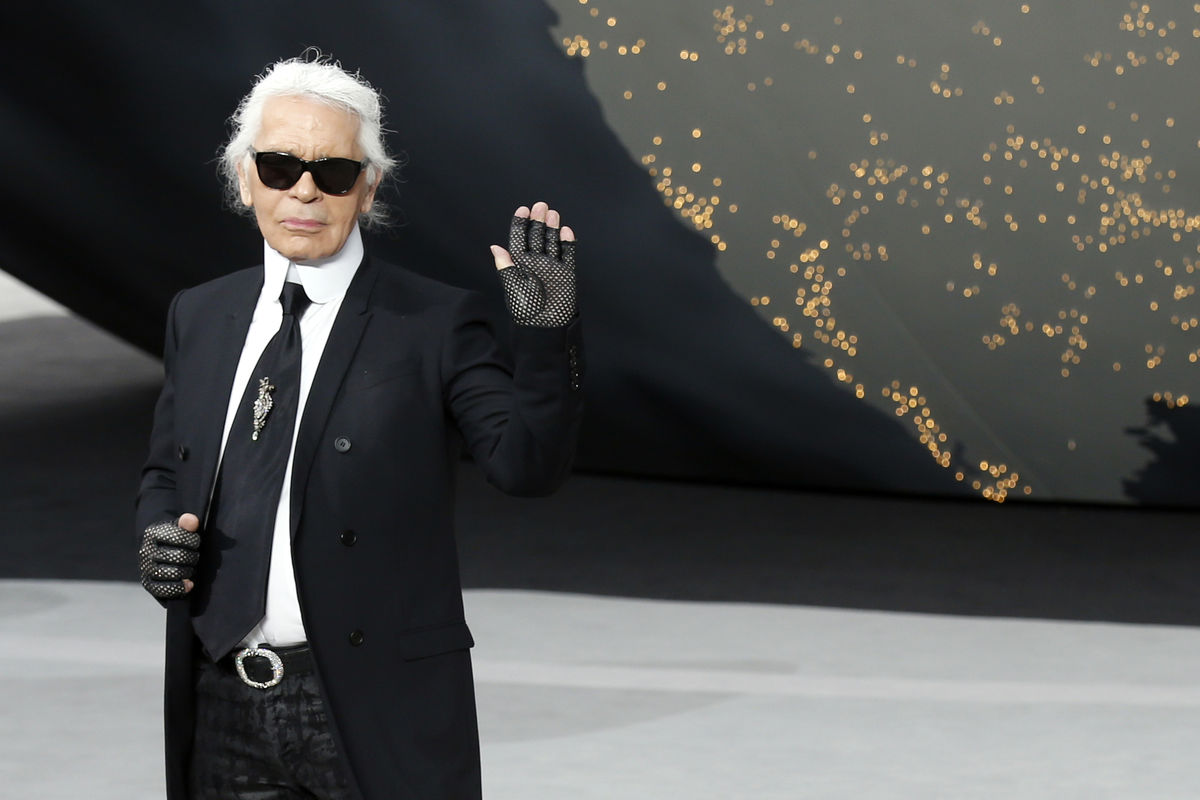German designer Lagerfeld appears at the end of his Fall-Winter 2013/2014 women's ready-to-wear fashion show for French fashion house Chanel during Paris fashion week