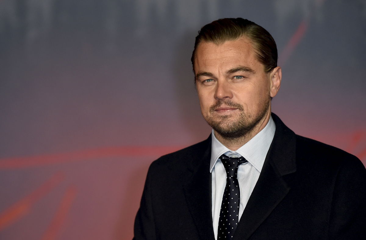Actor DiCaprio poses as he arrives for the British premiere of 