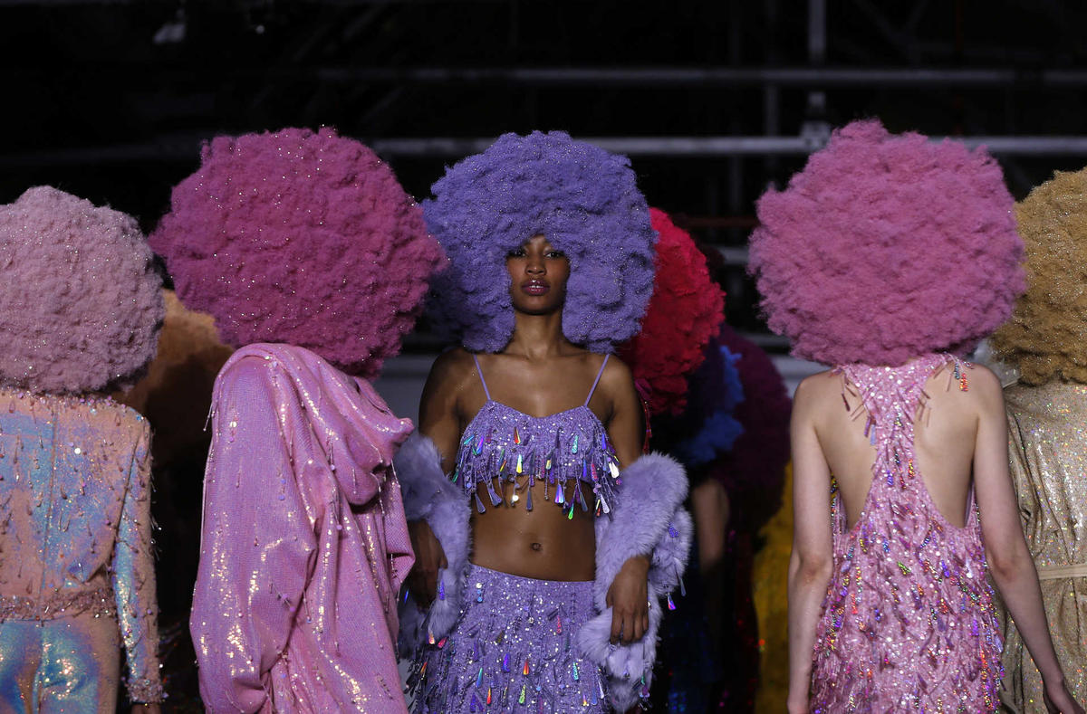 Models present creations at the Ashish catwalk show at London Fashion Week Autumn/Winter 2016 in London