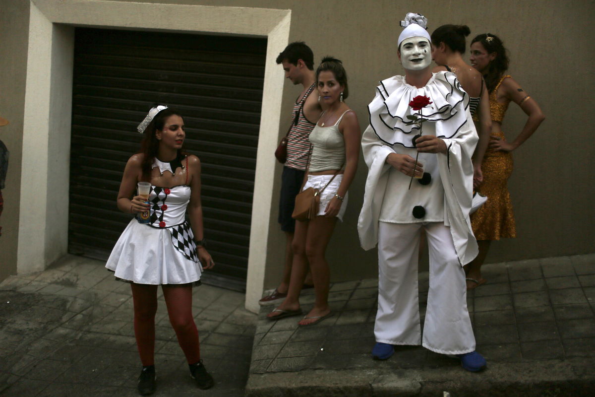 Revellers take part in an annual block party known as “Cordao de Prata Preta” in Rio de Janeiro
