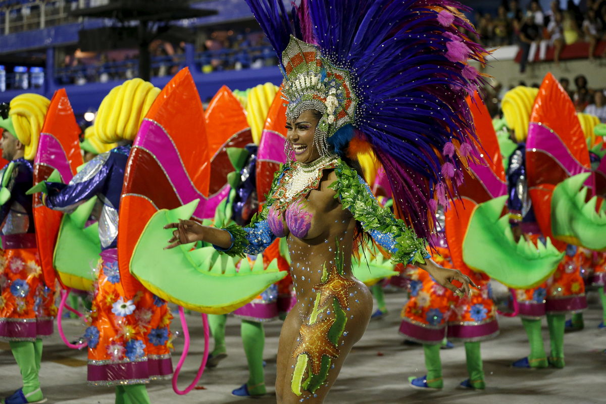 A reveller of Uniao da Ilha samba school performs during the carnival parade at the Sambadrome in Rio de Janeiro