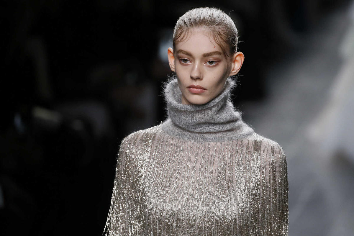 A model presents a creation by Italian designers Maria Grazia Chiuri and Pier Paolo Piccioli as part of their Fall/Winter 2016/2017 women’s ready-to-wear collection for fashion house Valentino in Paris