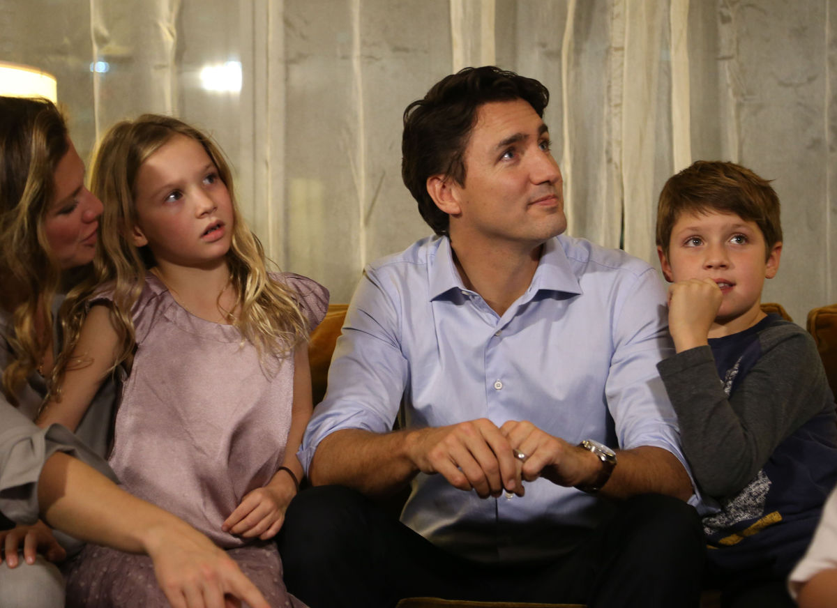 Liberal leader Justin Trudeau sits with his family at his election night headquarters in Montreal