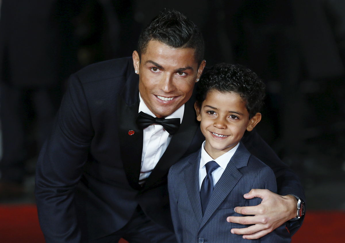 Soccer player Ronaldo and his son Ronaldo Jr. pose for photographers on the red carpet at the world premiere of “Ronaldo” at Leicester Square in London