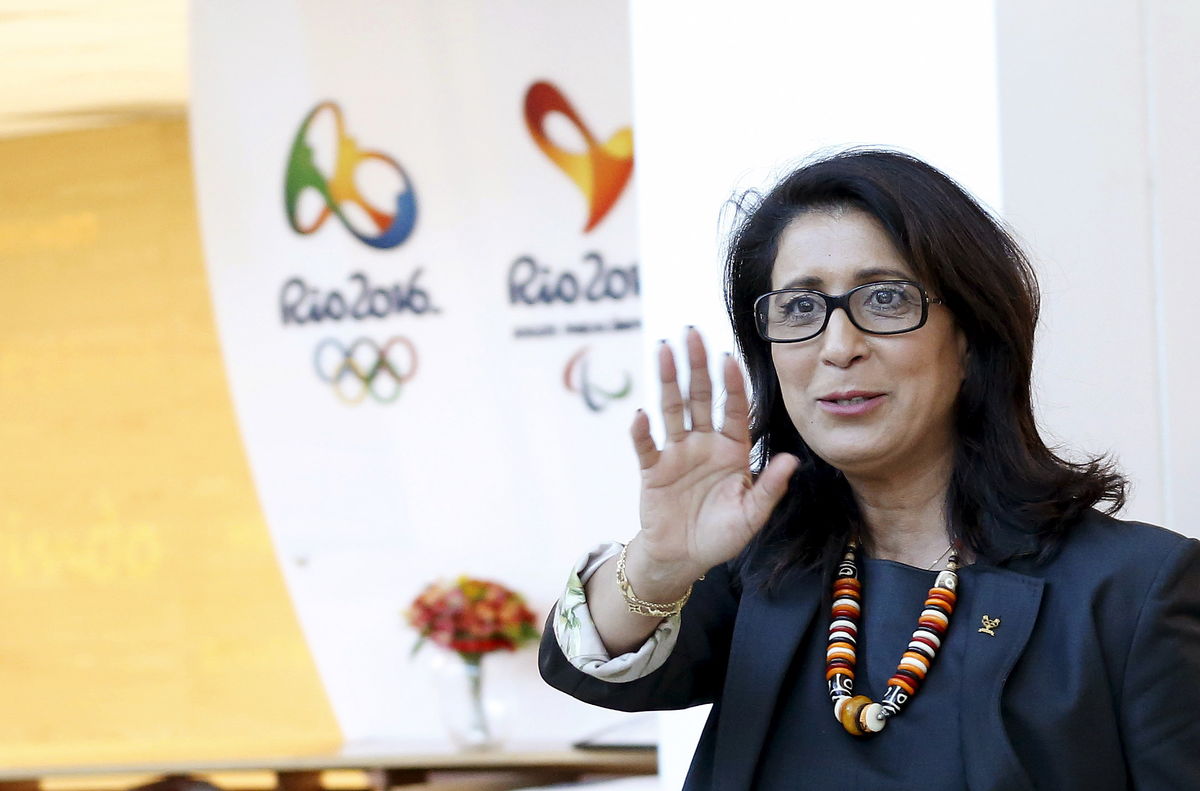 IOC Evaluation Commission head Nawal El Moutawakel waves after a news conference in Rio de Janeiro, Brazil
