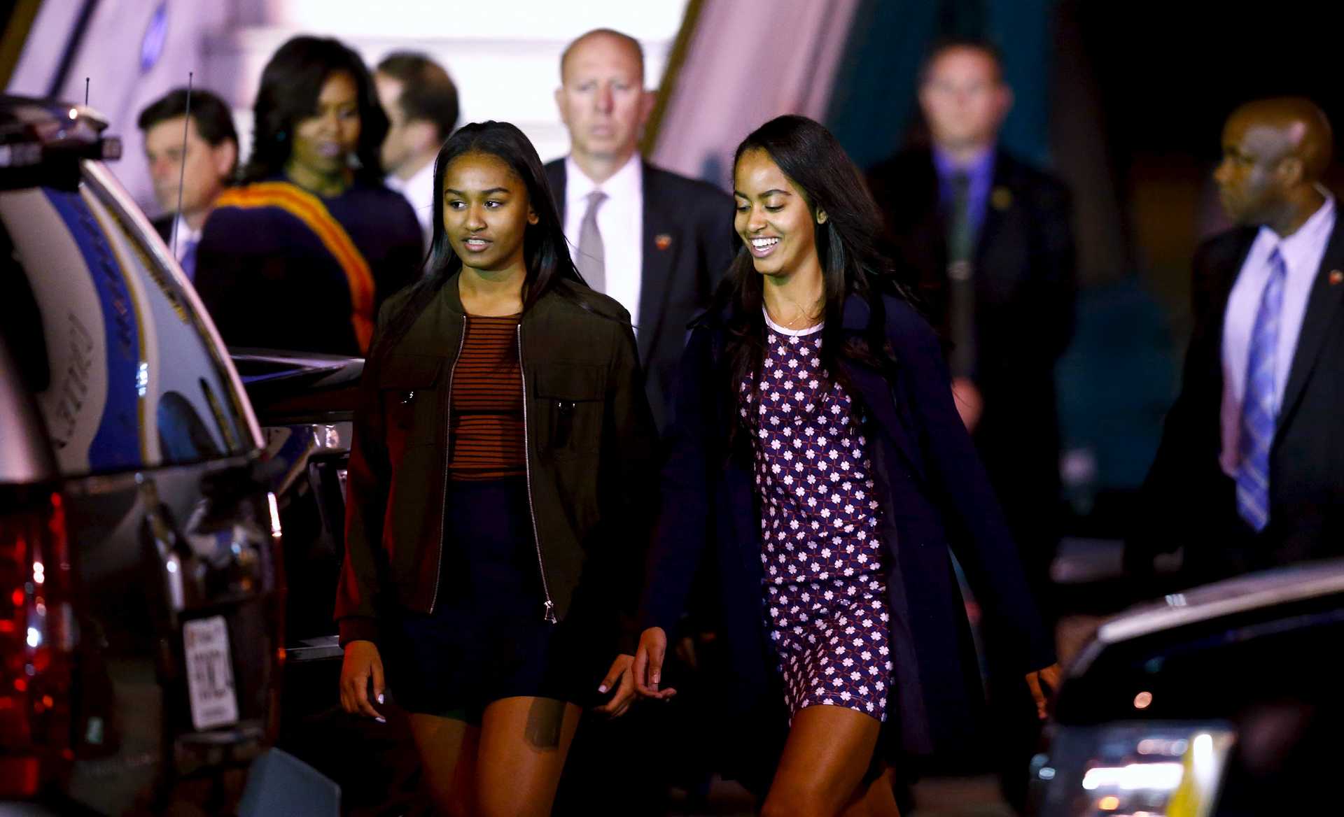 Daughters of U.S. President Barack Obama Sasha and Malia along First Lady Michelle Obama arrive at Buenos Aires’ international airport