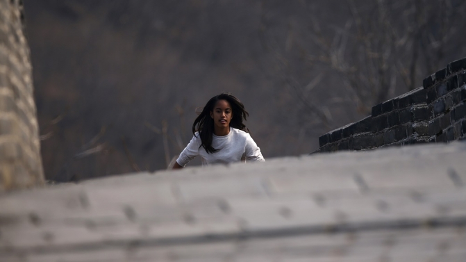 Malia, daughter of U.S. first lady Michelle Obama, climbs the steps as she visits the Mutianyu section of the Great Wall of China, in Beijing