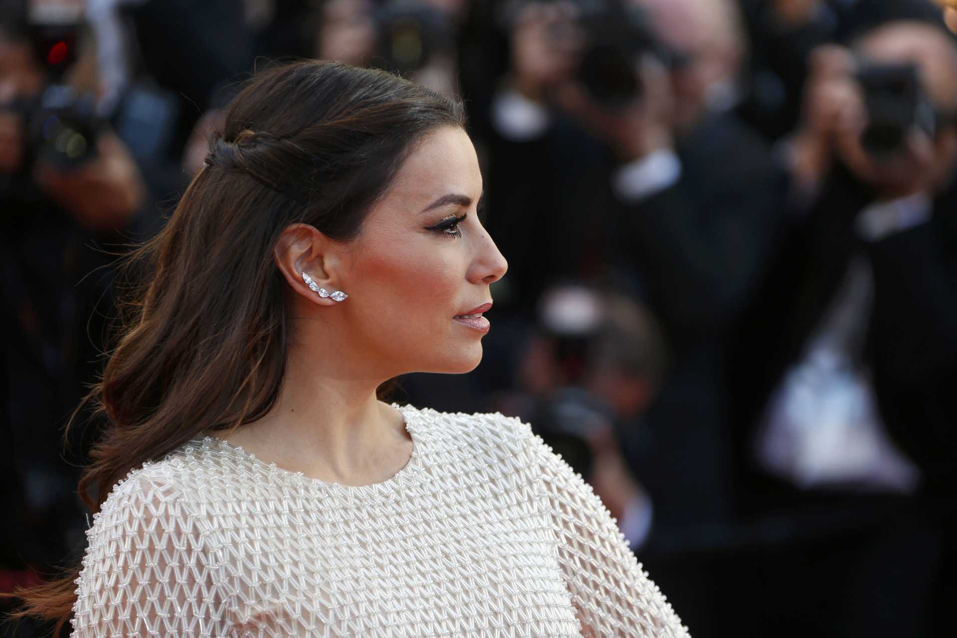 Actress Eva Longoria poses on the red carpet as she arrives for the opening ceremony and the screening of the film “Cafe Society” out of competition during the 69th Cannes Film Festival in Cannes