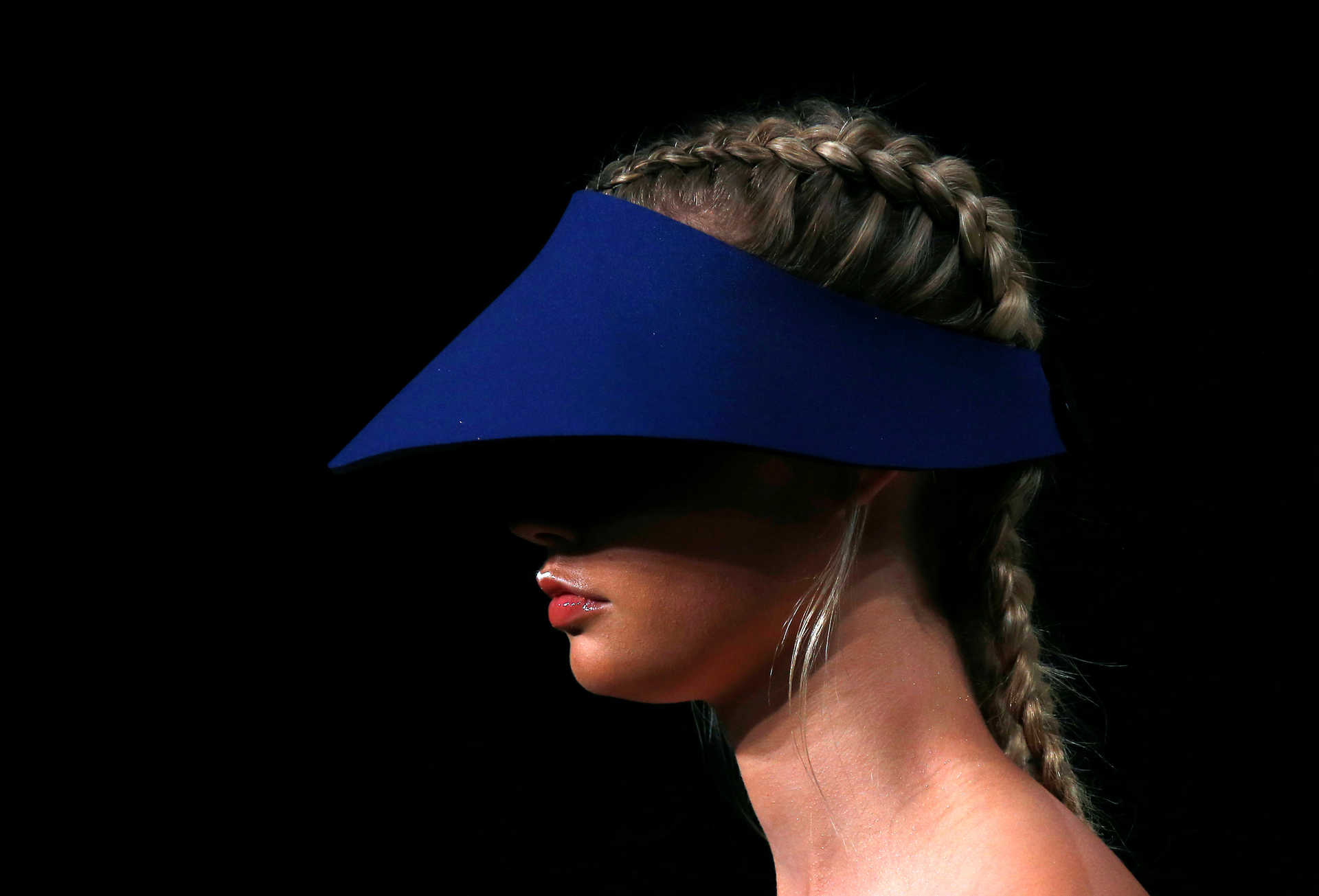 A model wears a hat as she presents a creation from the fashion label Bondi Bather during Australian Fashion week in Sydney