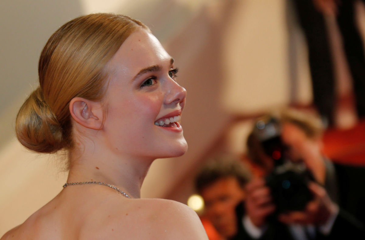 Cast member Elle Fanning  arrives on the red carpet ahead of the screening for the film “The Neon Demon” in competition at the 69th Cannes Film Festival in Cannes