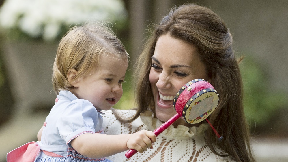 The Duchess of Cambridge holds Princess Charlotte during a children’s party in Victoria