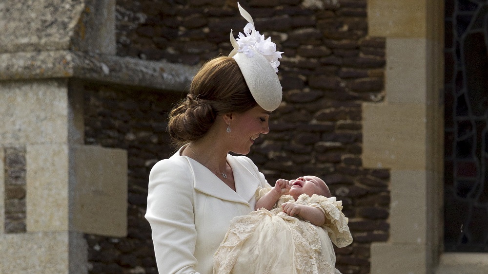 Britain’s Catherine, Duchess of Cambridge, arrives with her daughter Princess Charlotte for her christening at the Church of St. Mary Magdalene in Sandringham
