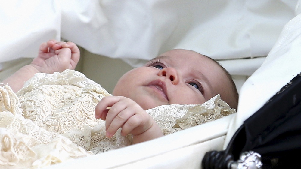 Princess Charlotte is seen inside a pram as she leaves the Church of St Mary Magdalene