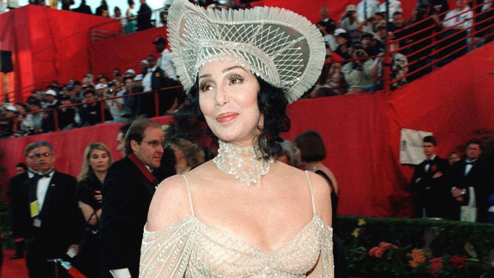 Wearing a Bob Macki gown, former Academy Award winner for best actress Cher arrives at the 70th annu..