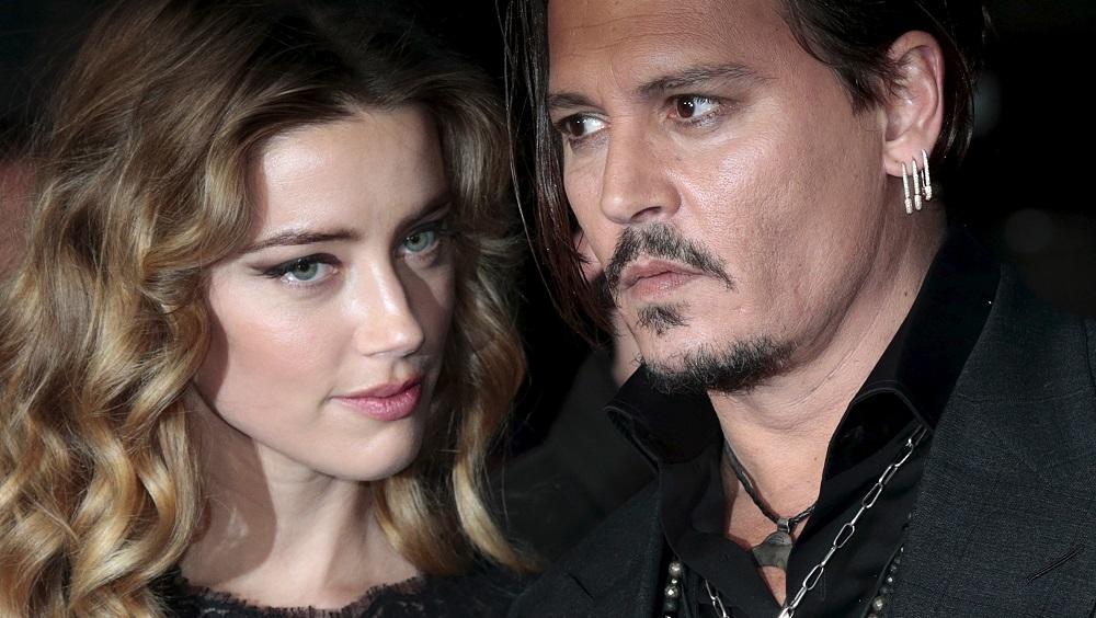 Cast member Johnny Depp and his actress wife Amber Heard arrive for the British premiere of the film 