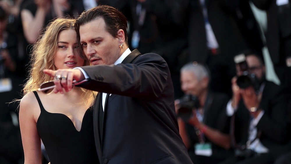 Actor Depp and his wife Heard attend the red carpet event for the movie 