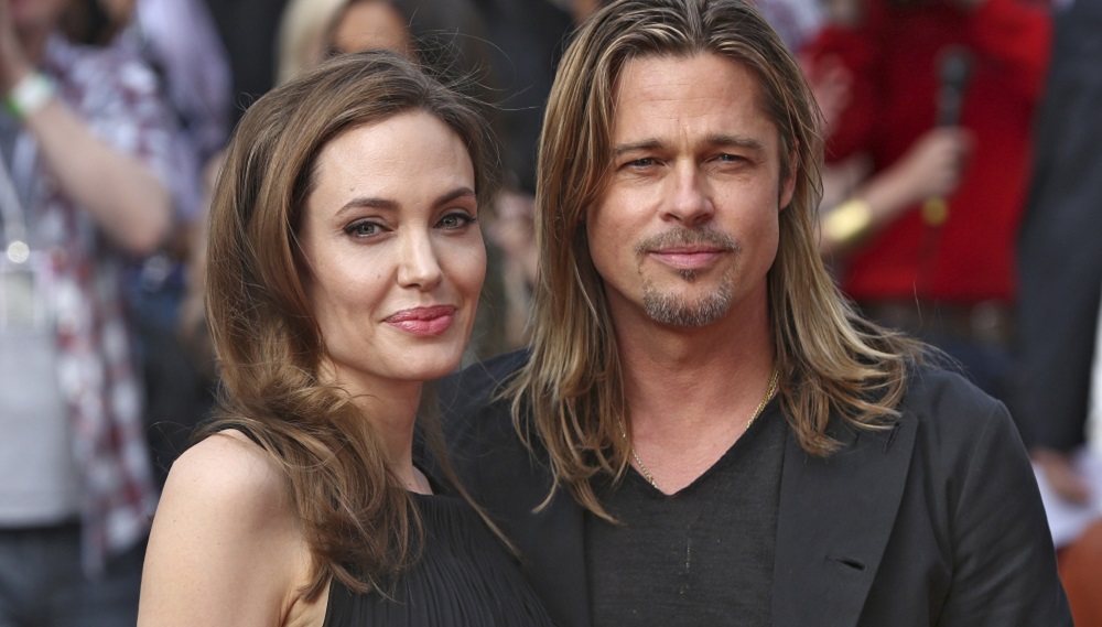 Angelina Jolie poses with her fiance Brad Pitt as they arrive for the world premiere of his film World War Z in London