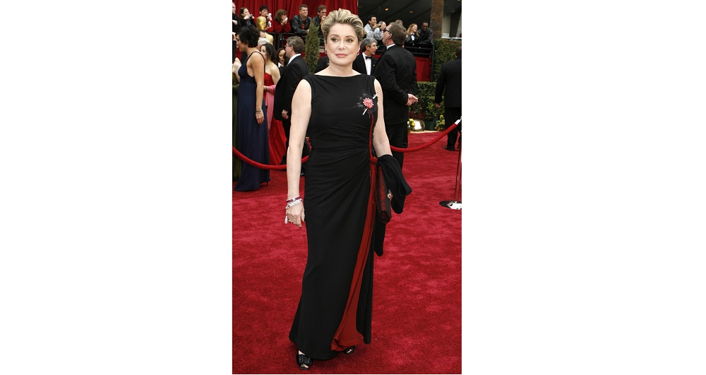 Actress Catherine Deneuve wearing Jean Paul Gaultier arrives at the 79th Annual Academy Awards in Hollywood