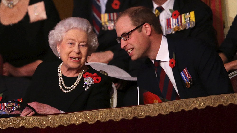 Britain’s Queen Elizabeth and Prince William, Duke of Cambridge, chat with each other in the Royal Box at the Royal Albert Hall during the Annual Festival of Remembrance in London