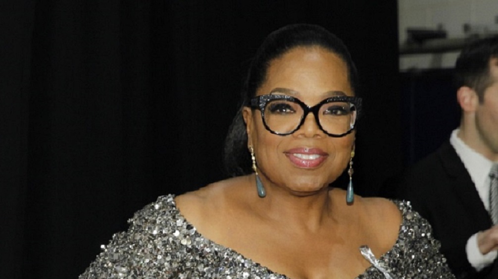 Entertainer Oprah Winfrey poses backstage during the American Theatre Wing's 70th annual Tony Awards in New York