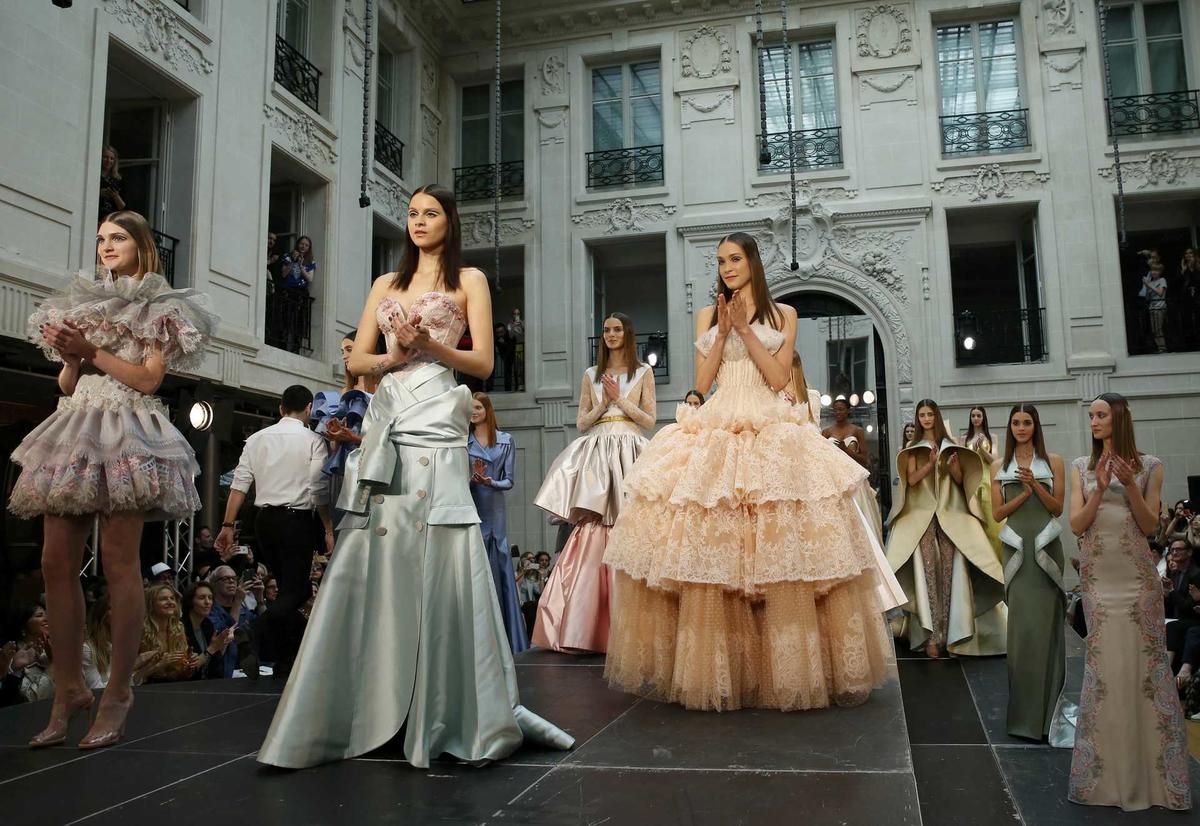 Models present creations by French designer Alexis Mabille as part of his Haute Couture Fall/Winter 2016/2017 collection in Paris