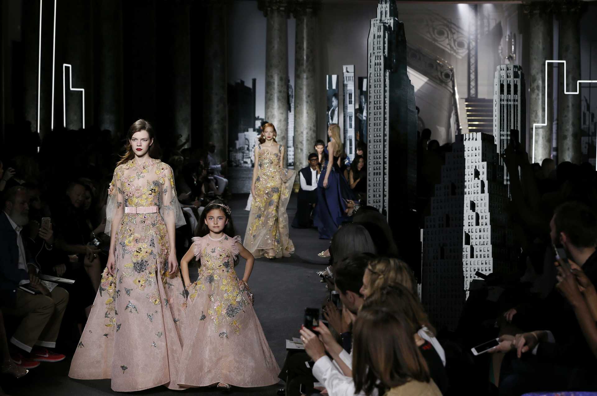 Models present creations by Lebanese designer Elie Saab as part of his Haute Couture Fall/Winter 2016/2017 collection in Paris