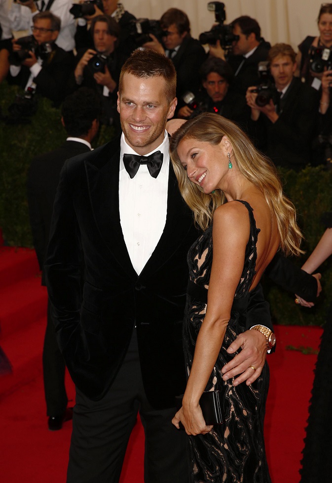 Ao lado do marido, Tom Brady, em 2014