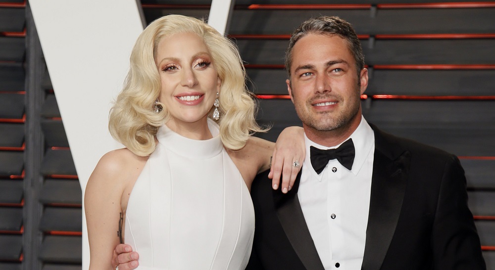 Singer Lady Gaga and her fiance Taylor Kinney arrive at the Vanity Fair Oscar Party in Beverly Hills, California