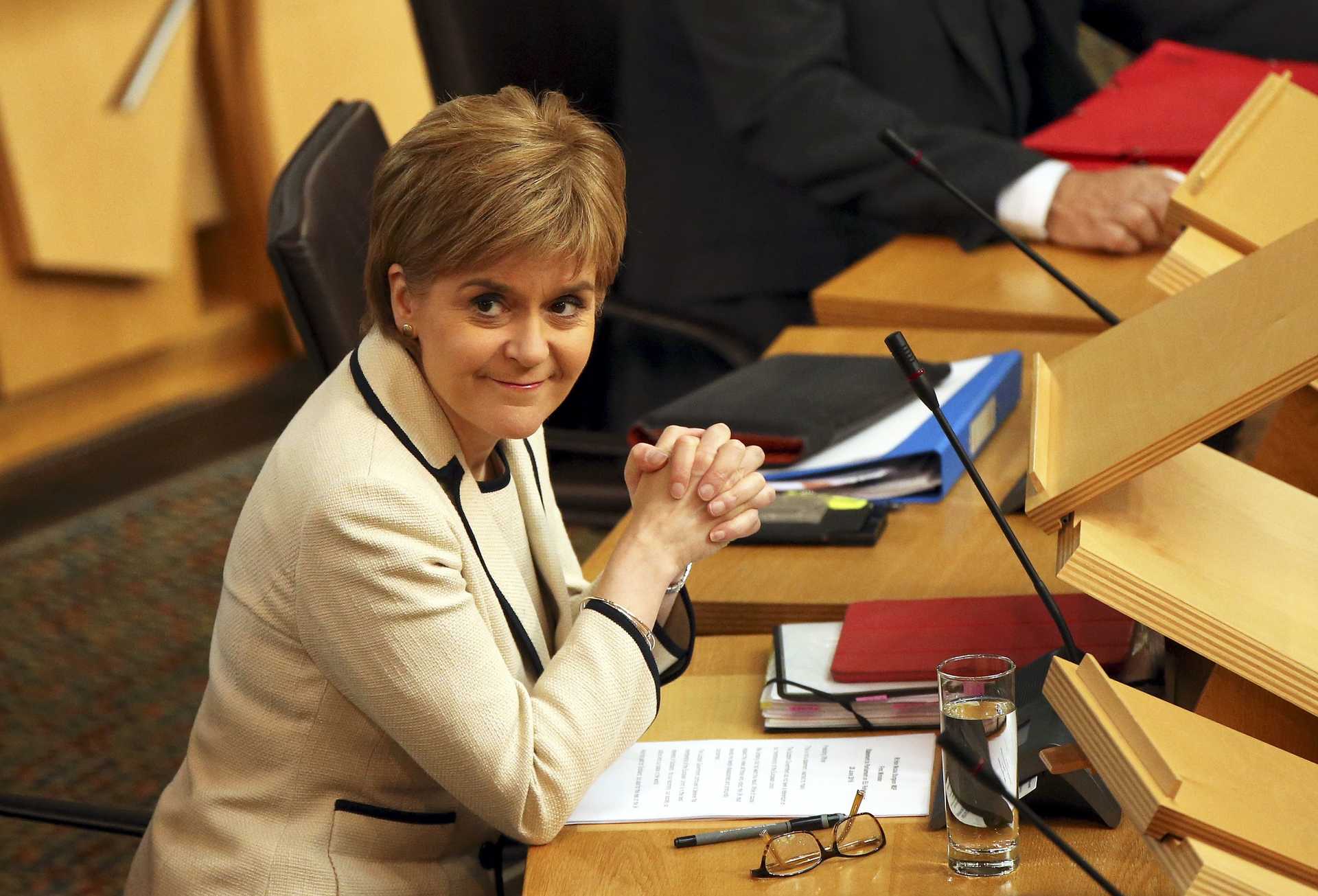 Scotland's First Minister Nicola Sturgeon listens in the debating chamber of the Scottish Parliament at Holyrood in Edinburgh