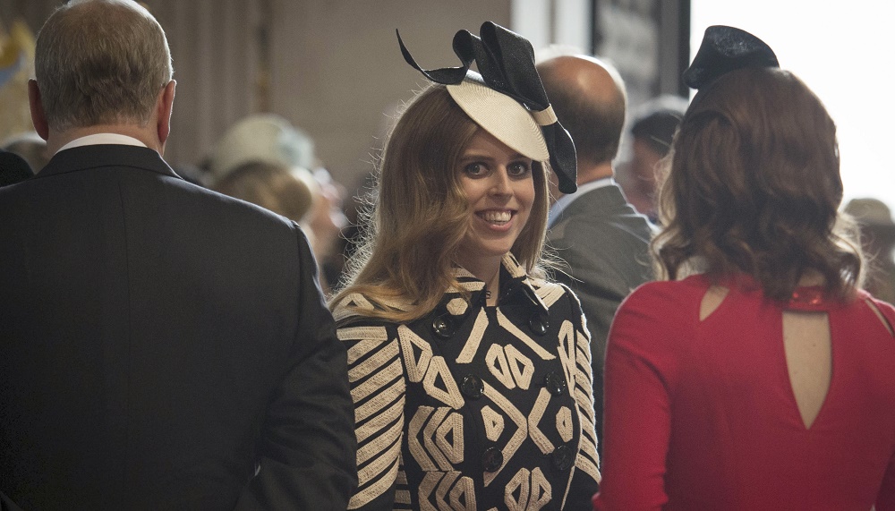 Britain's Prince Andrew, Princess Beatrice and Princess Eugenie arrive for a service of thanksgiving to mark the 90th birthday of Britain's Queen Elizabeth at St Paul's Cathedral in London