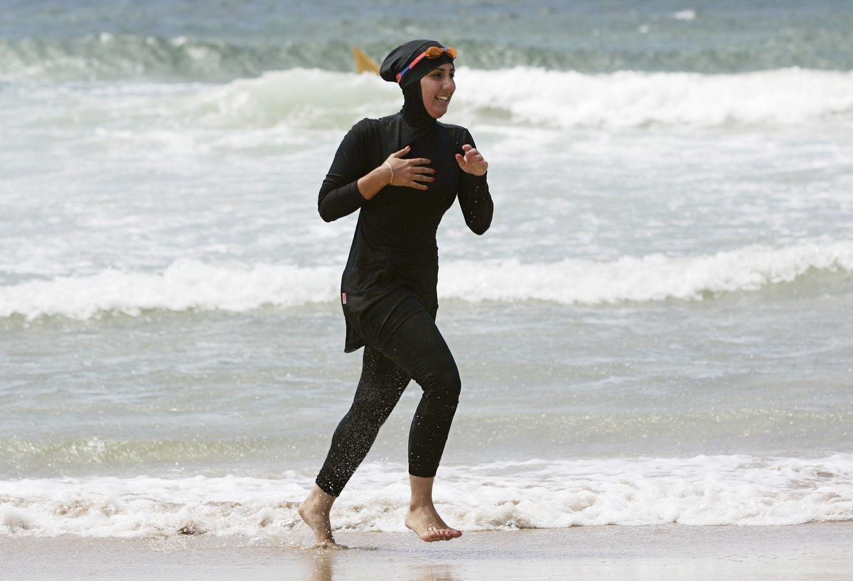 Trainee volunteer surf life saver Laalaa runs along North Cronulla Beach in Sydney