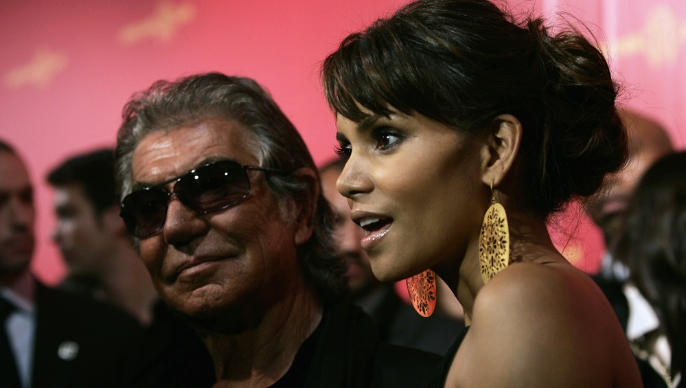 U.S actress Berry and Italian fashion designer Cavalli speak with journalists as they arrive at a party in Rome