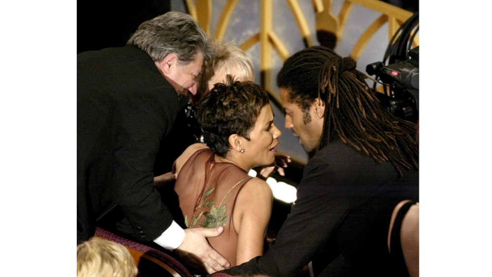 HALLE BERRY REACTS WITH HUSBAND TO WINNING BEST ACTRESS ACADEMY AWARD
IN HOLLYWOOD.