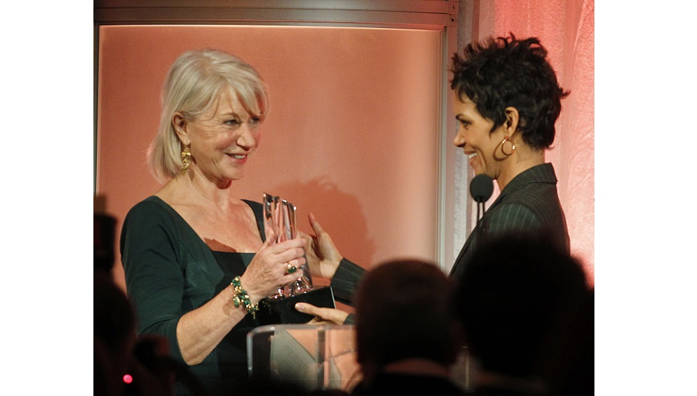 Actress Halle Berry (R) presents Helen Mirren with the Sherry Lansing Leadership Award in Beverly Hills