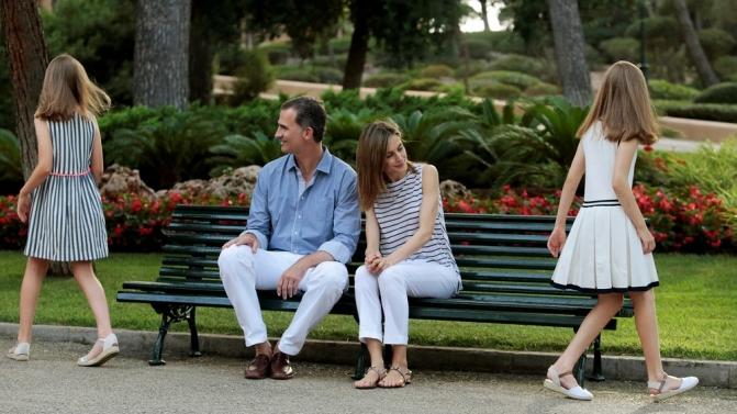 Spain’s King Felipe and his daughter Princess Sofia pose during a photocall in the gardens of the Marivent Palace in Palma de Mallorca