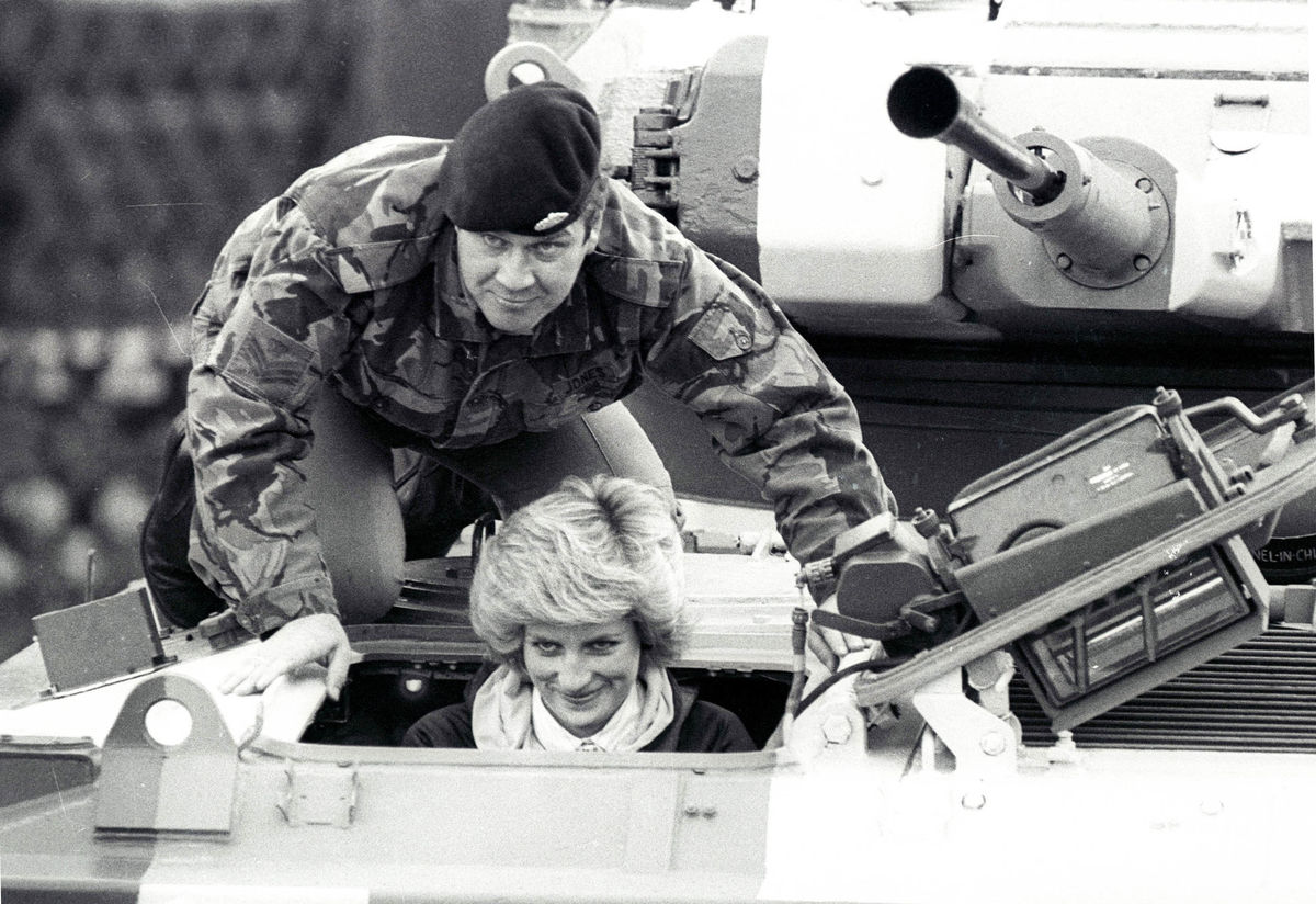 Princess Diana sits in a vehicle on a visit to Wavell Barracks, the base of the Royal Hampshire Regiment, in Berlin