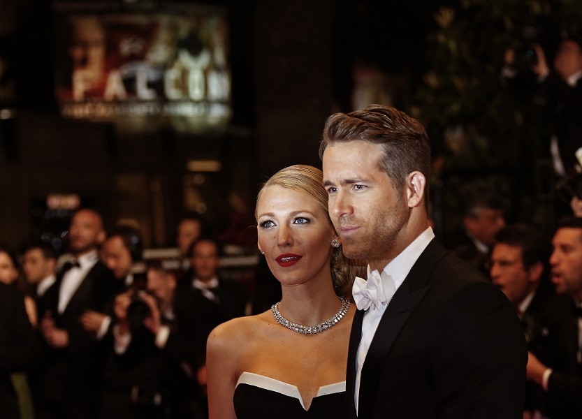 Cast member Ryan Reynolds and his wife actress Blake Lively pose on the red carpet as they arrive for the screening of the film 