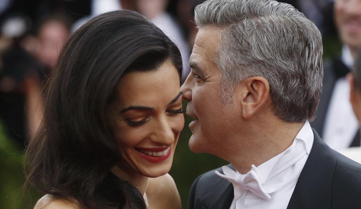 George Clooney and wife Amal Clooney arrive at the Metropolitan Museum of Art Costume Institute Gala 2015 celebrating the opening of “China: Through the Looking Glass,” in Manhattan