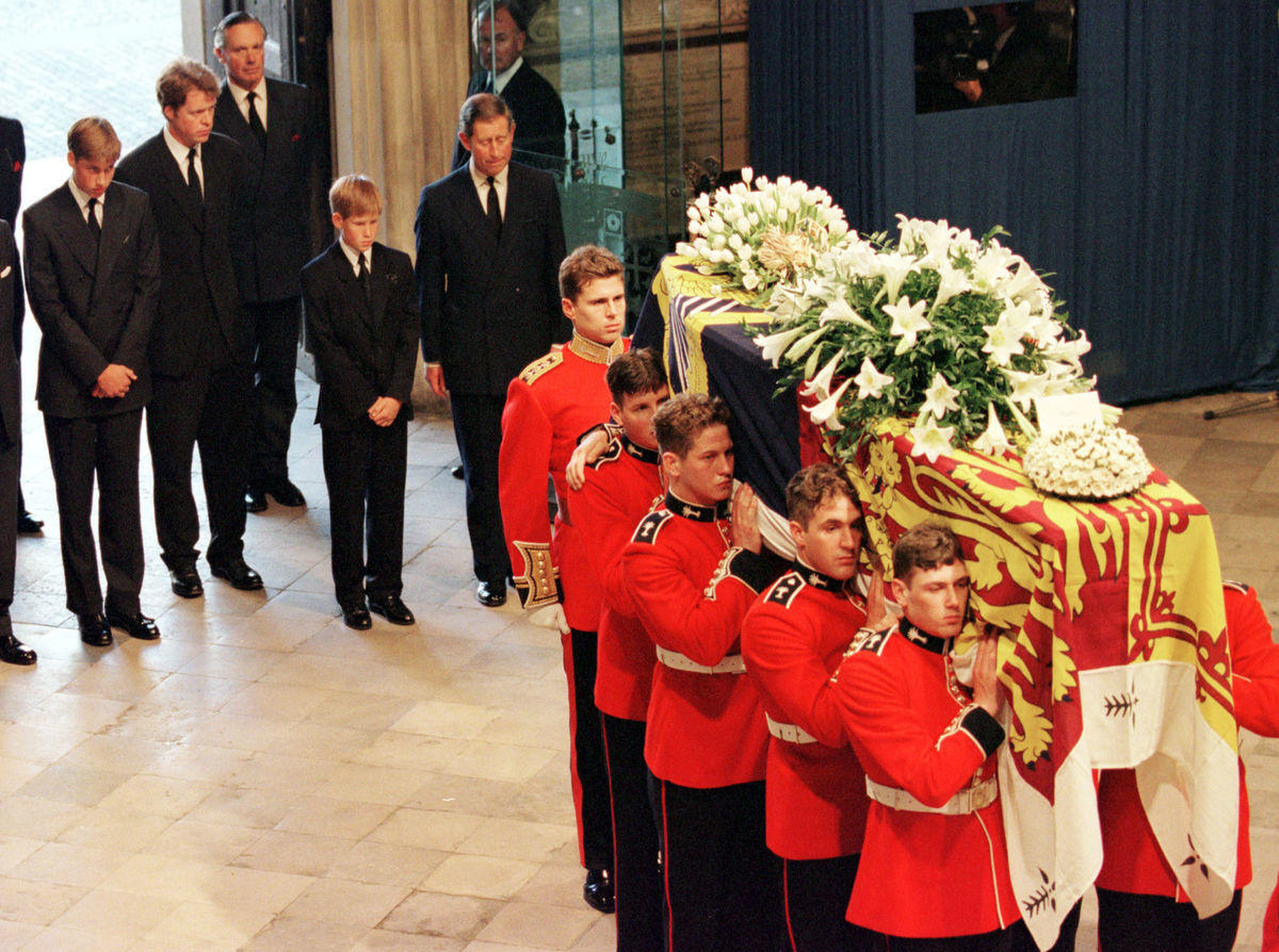 Prince William, Earl Spencer, Prince Harry and Prince Charles follow the coffin of Diana, Princess o..