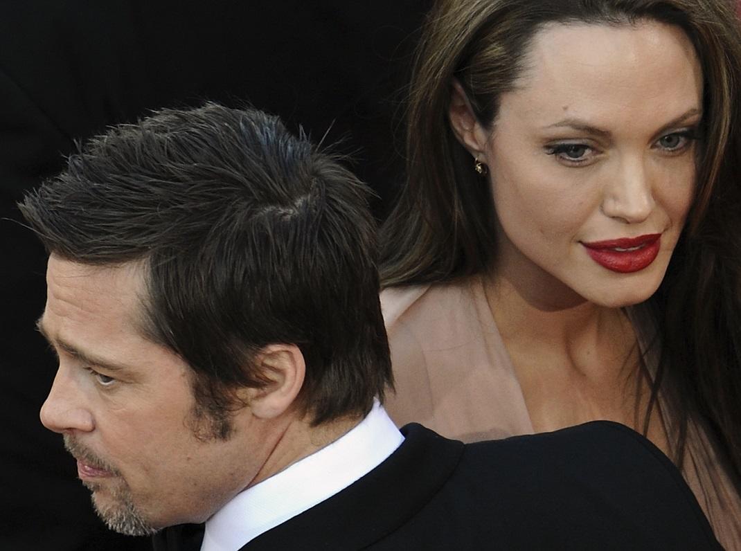 Cast member Pitt and Jolie arrive on the red carpet for the screening of the film 