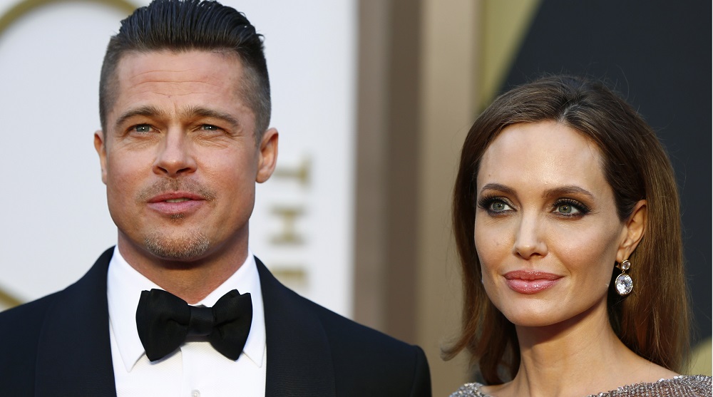 Actors Brad Pitt and Angelina Jolie arrive at the 86th Academy Awards in Hollywood
