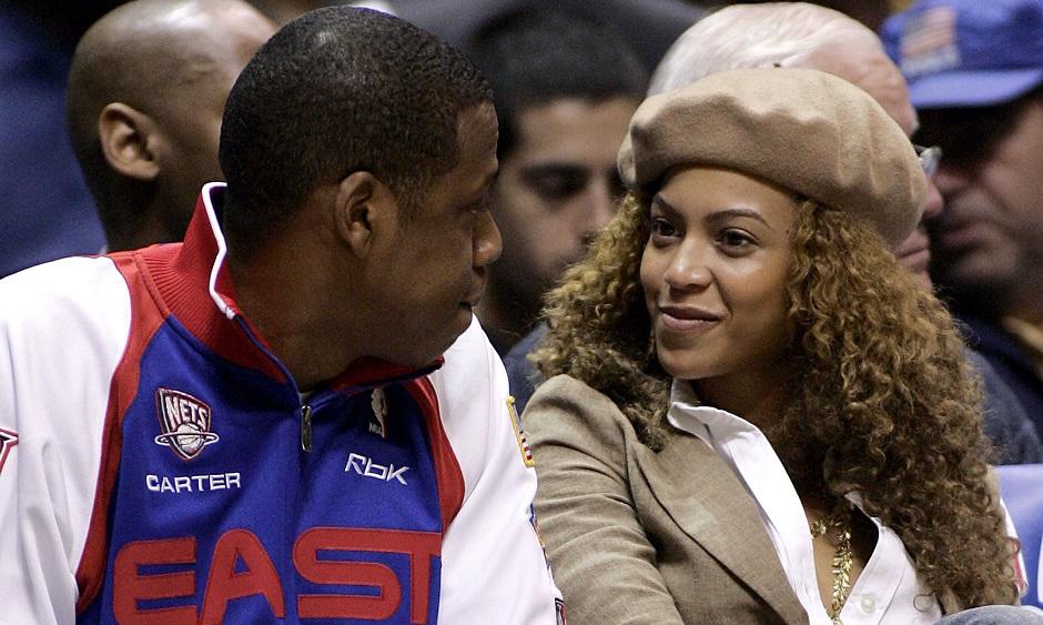 Rapper Jay-Z and Beyonce exchange glance while New Jersey Nets play against Indiana Pacers in East Rutherford