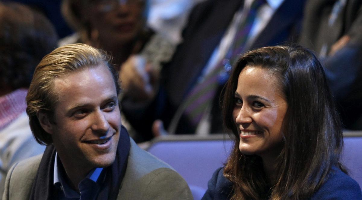 Britain’s Pippa Middleton an an unidentified companion watch the men’s singles tennis final between Jo-Wilfried Tsonga of France and Roger Federer of Switzerland at the ATP World Tour Finals at the O2 Arena in London