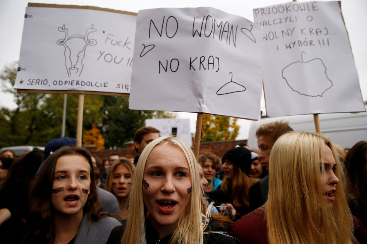 Women shout slogans as they gather in an abortion rights campaigners’ demonstration to protest against plans for a total ban on abortion in front of the ruling party Law and Justice (PiS) headquarters in Warsaw